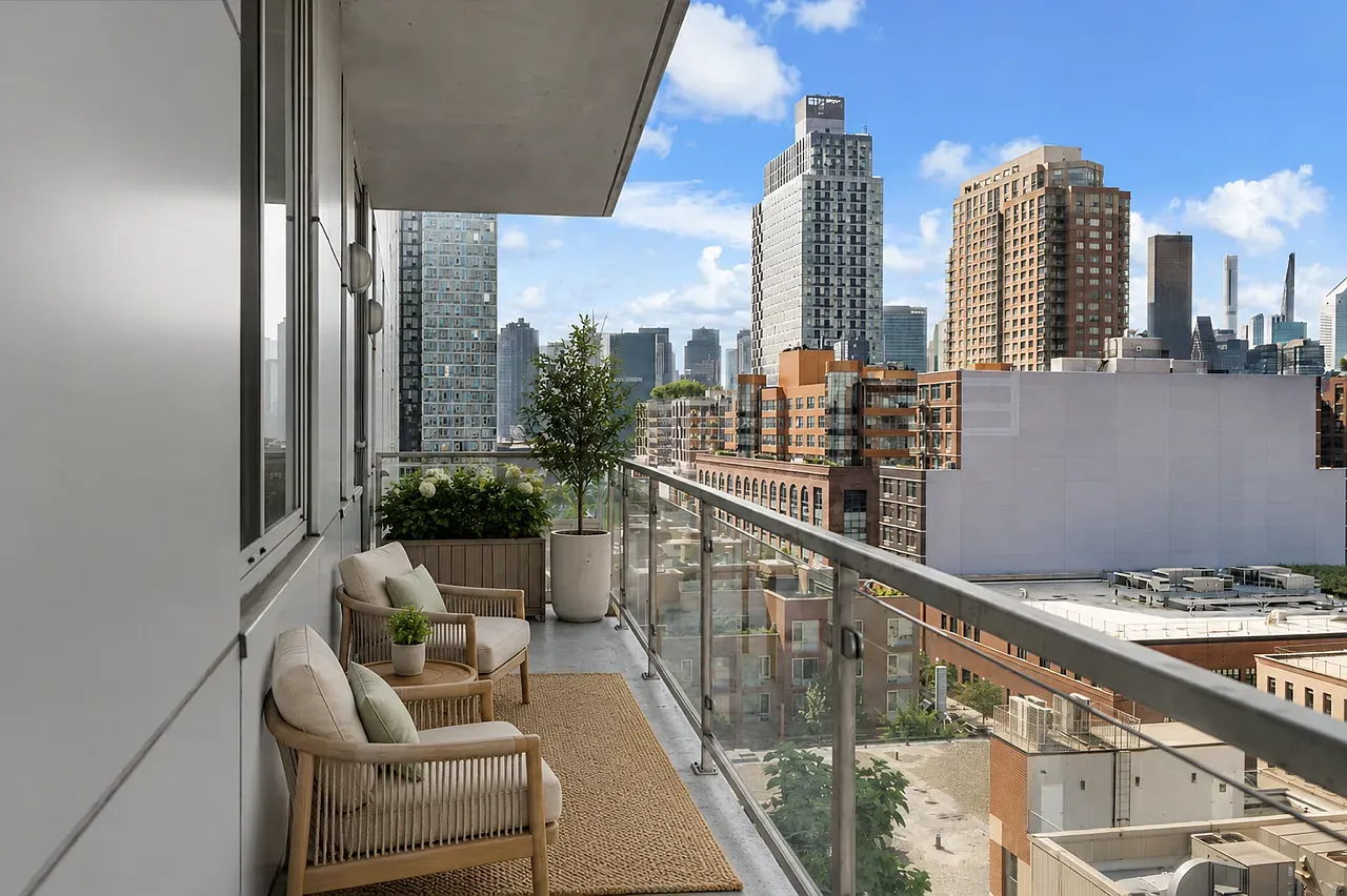 Furnished terrace at Murano Residence 9J overlooking Long Island City and the Manhattan skyline